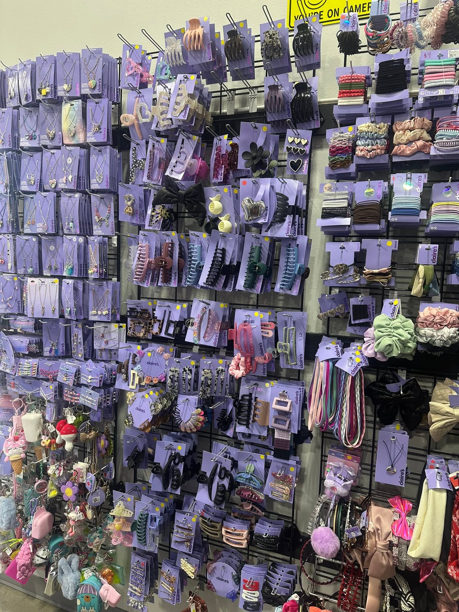 Wall display of hair clips, scrunchies and jewelry at Thrift It Out