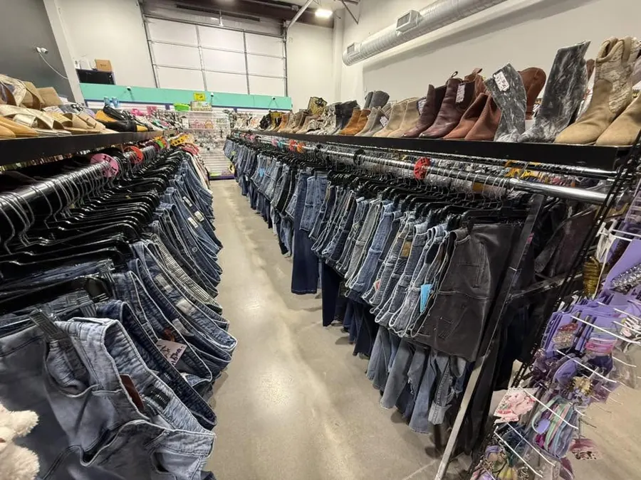 Clothing racks inside Thrift It Out in Hensley